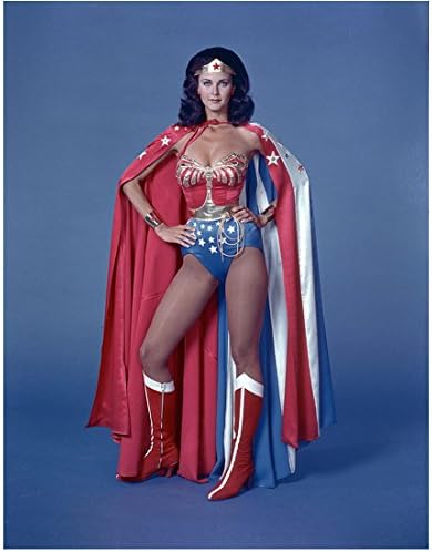 Lynda Carter 8 Inch x 10 Inch PHOTOGRAPH Wonder Woman TV Series (1975-1979) Wearing Cape Hands on Hips w/Blue Background kn